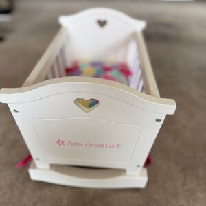 American Girl baby doll cradle with mattress.